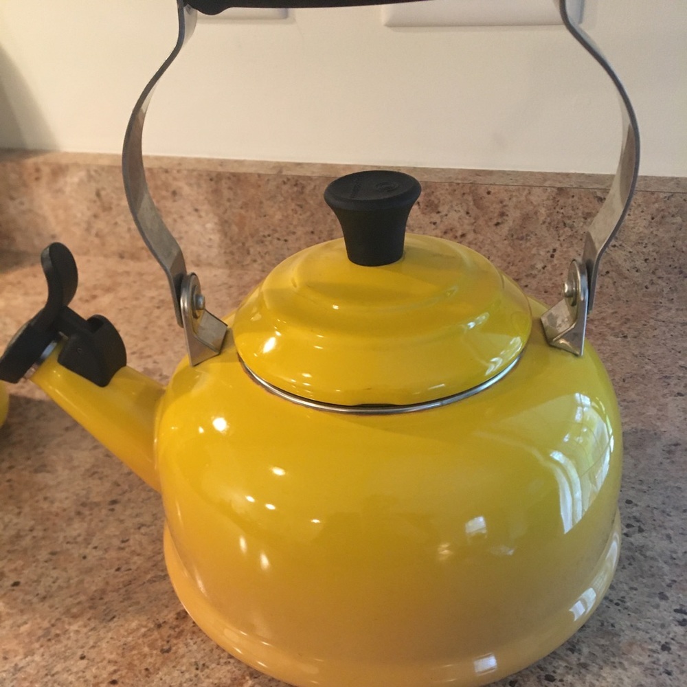 Yellow whistling tea pot. Le creuset.